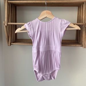 Kate Quinn new with tags, short sleeve pintuck, bubble, size 12-18m in Lavender.